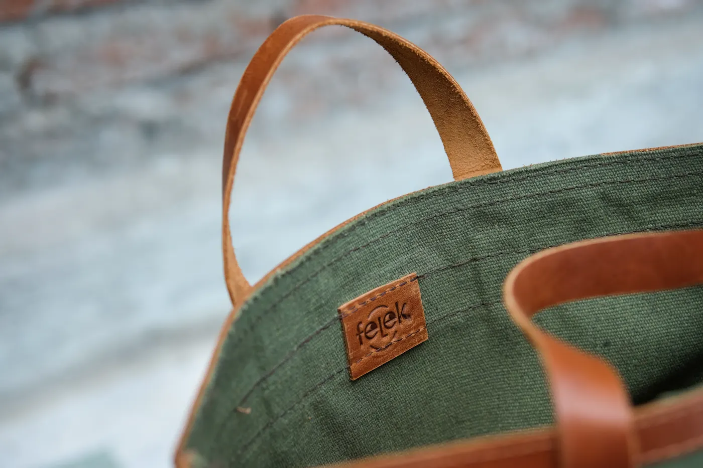 Embossed leather label inside a Felek conference bag