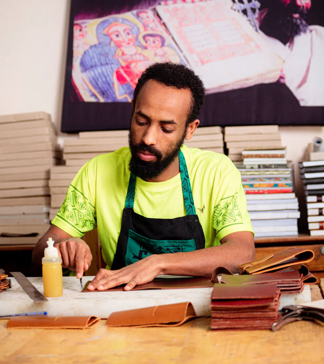 Felek craftsman hand-finishing leather journals in the Addis Ababa workshop