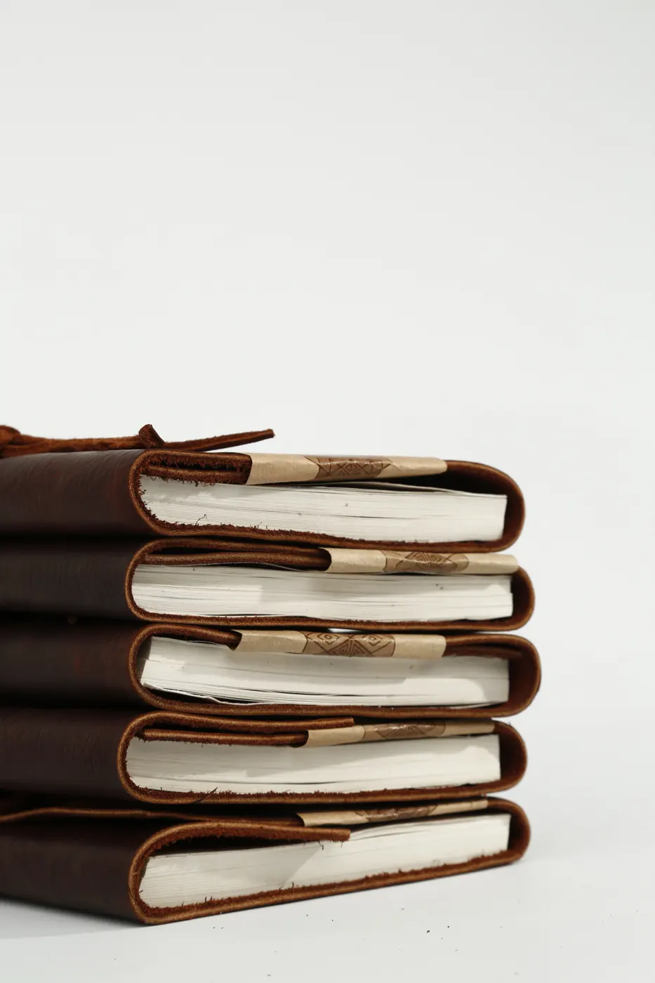 Stack of Felek leather journals